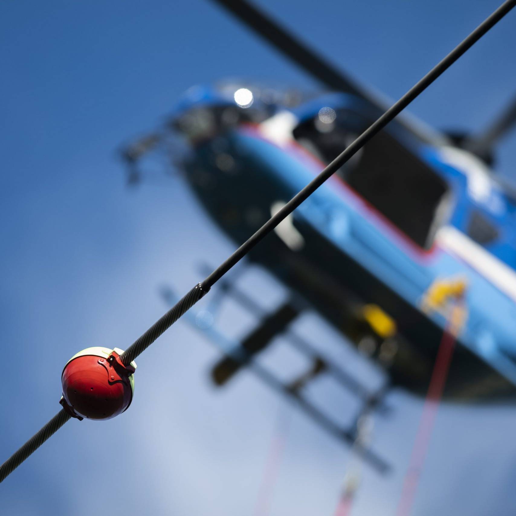 an image of a helicopter with human external cargo baskets