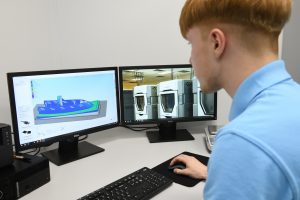 image of a team member from Air Frame Designs working on a computer
