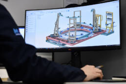 image of man on computer as blog header for Why Is CAD Essential For Modern Aerospace Design?